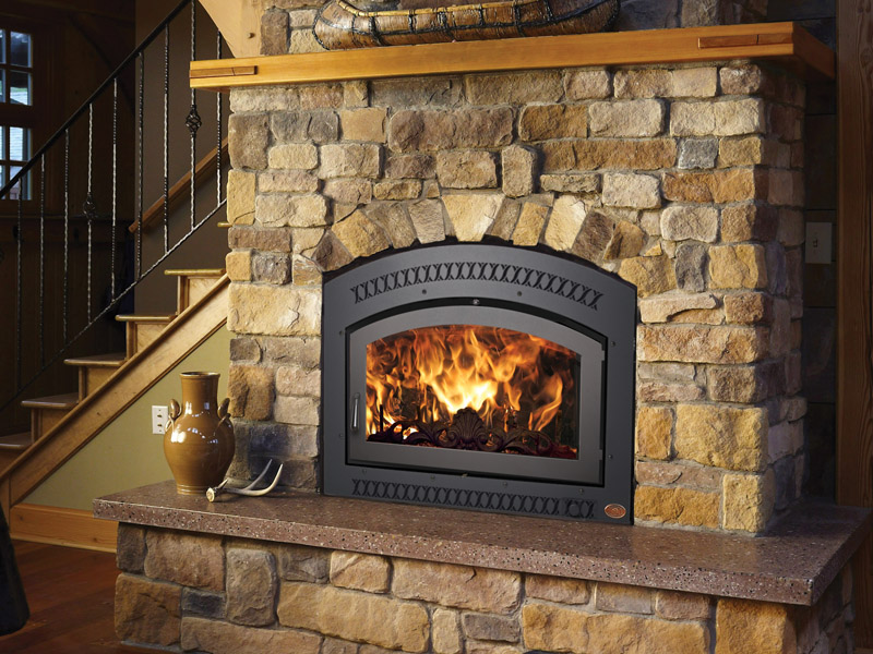 A custom stone fireplace installation in Jackson, MI, featuring a modern interior design on display at the Storey Fireplace & Chimney local showroom.